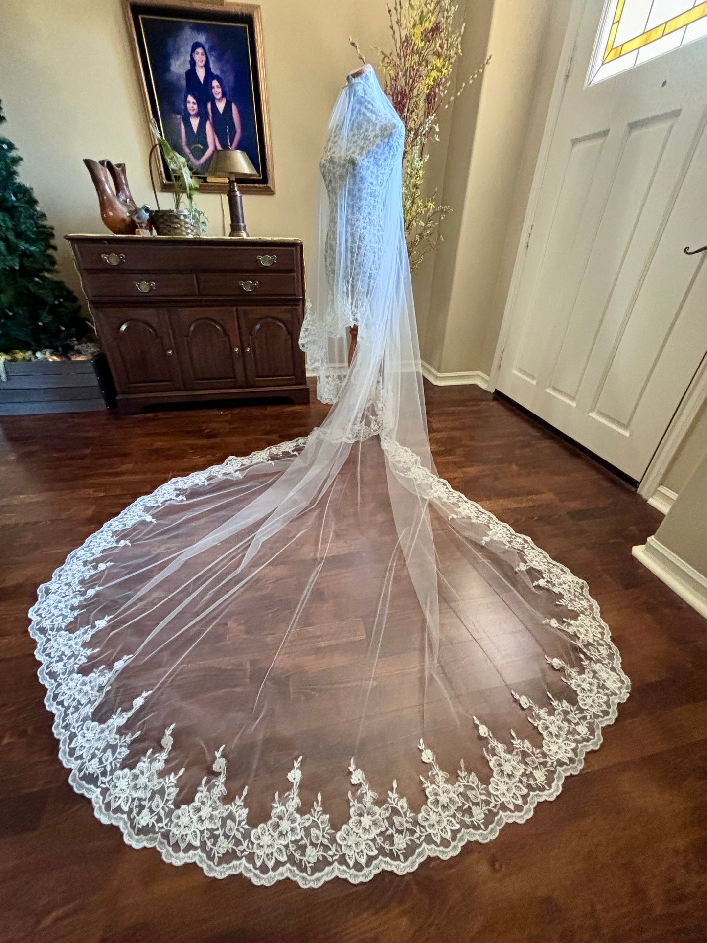 drop royal length Lace wedding veil on a wooden floor in California