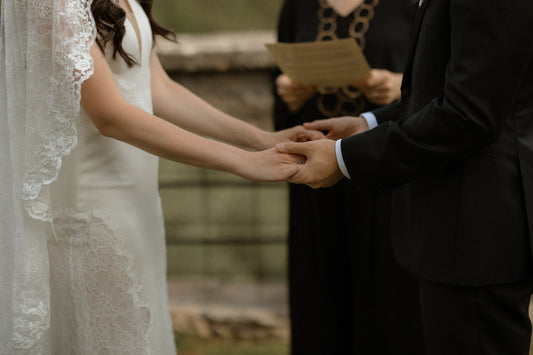 Italy wedding with bride and groom exchanging vows in countryside vineyards