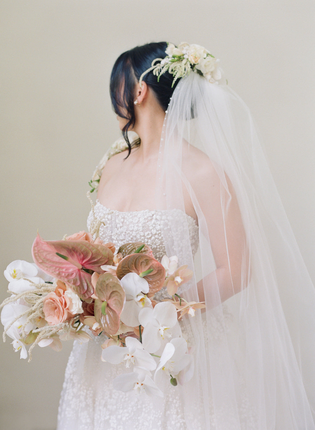 high fashion bride in embroidered gown and long bridal veil