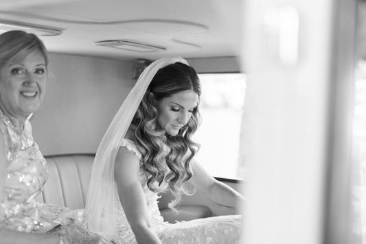long bridal veil in soft white for bride in car with mom for her wedding