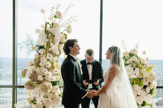 white floral arches and mantilla veil on bride with custom beaded vines and pearls