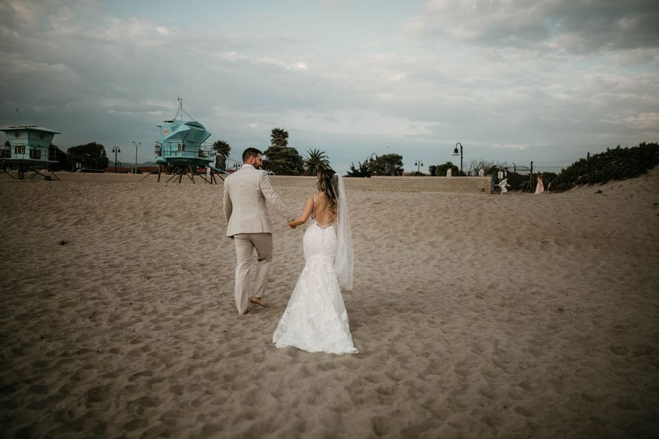 Load video: Jewish wedding ceremony with lace gown and simple raw edge medium length bridal veil