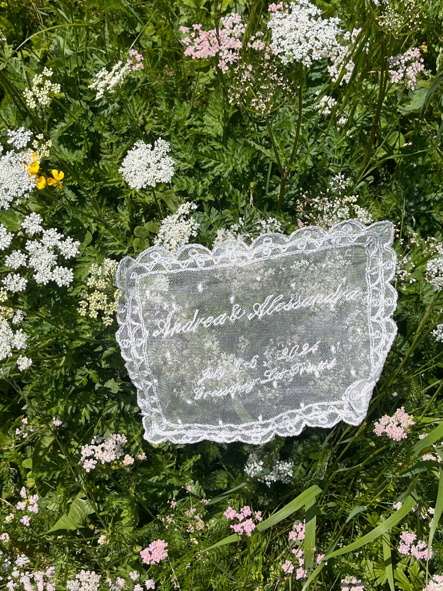 Lace custom handkerchief doily with floral patterns on a grassy background