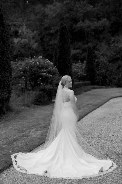 long eyelash lace trimmed cathedral bridal veil over low bun