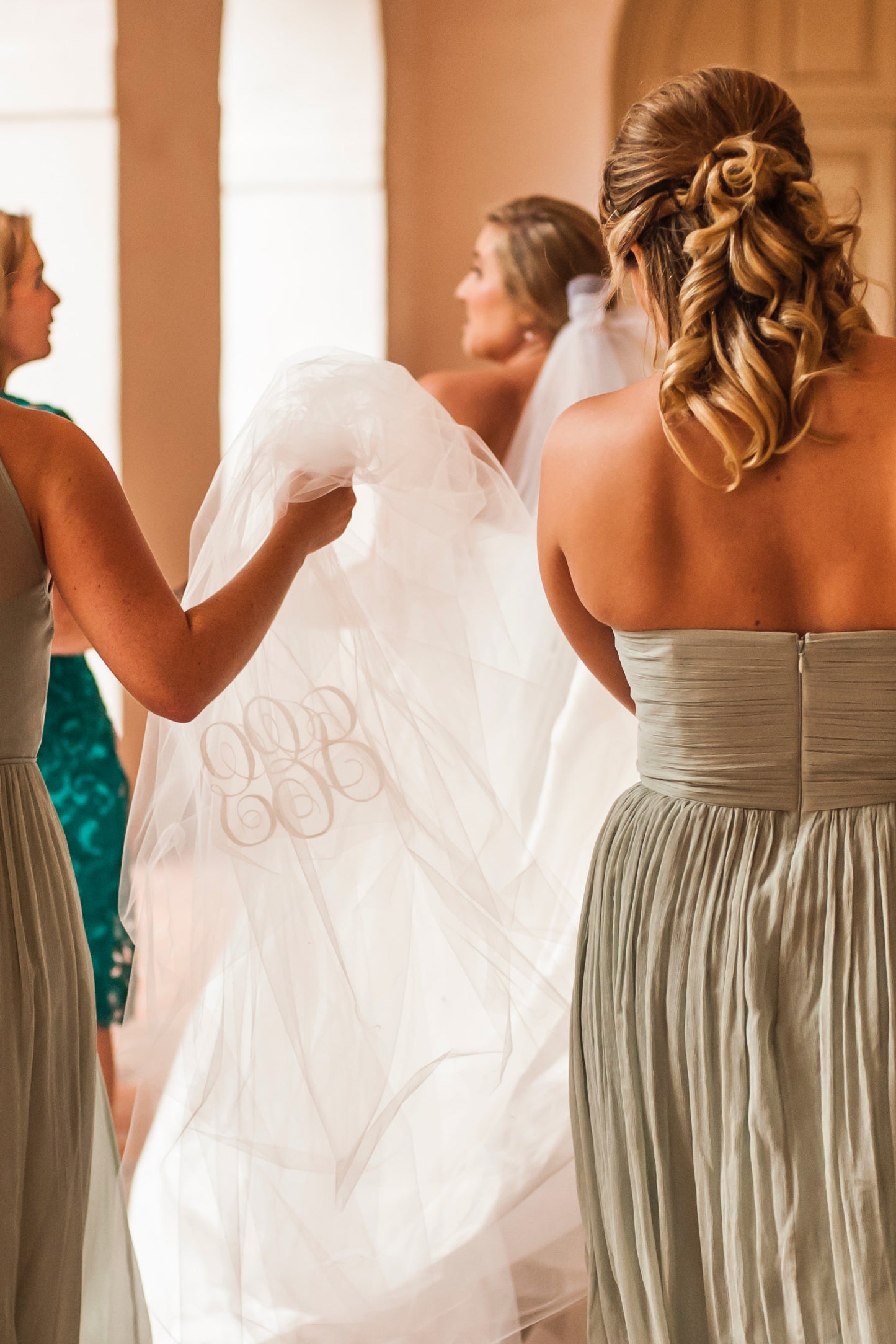 script monogram for married couple on bottom of tulle wedding veil