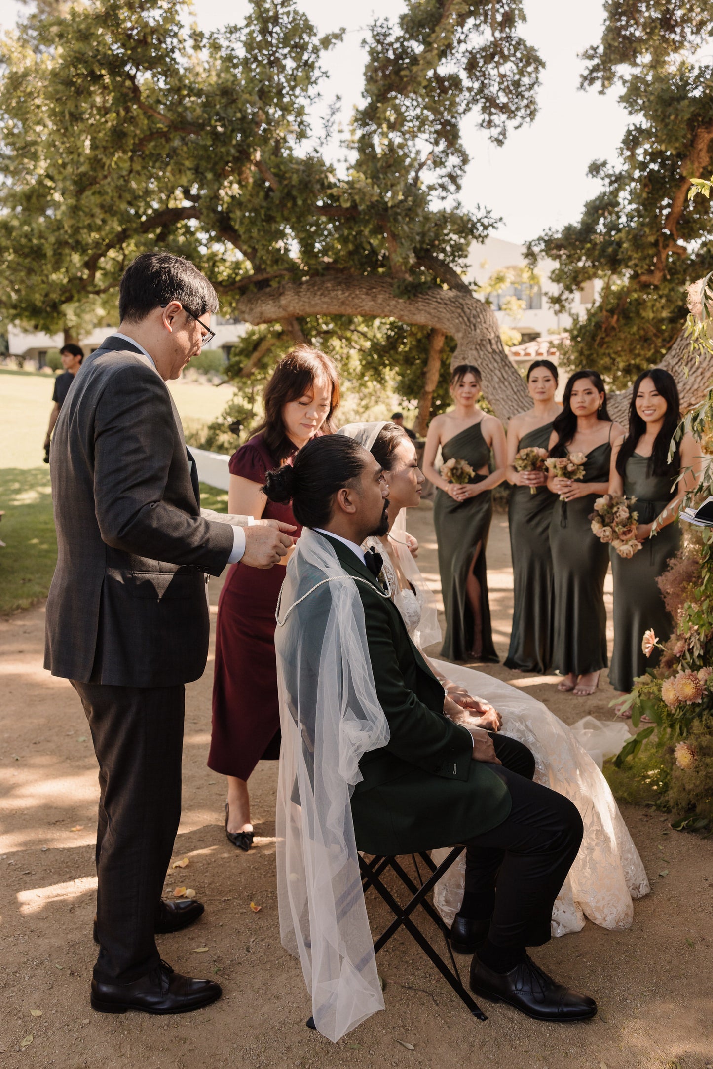 white unity veil over couple's shoulders and cords 