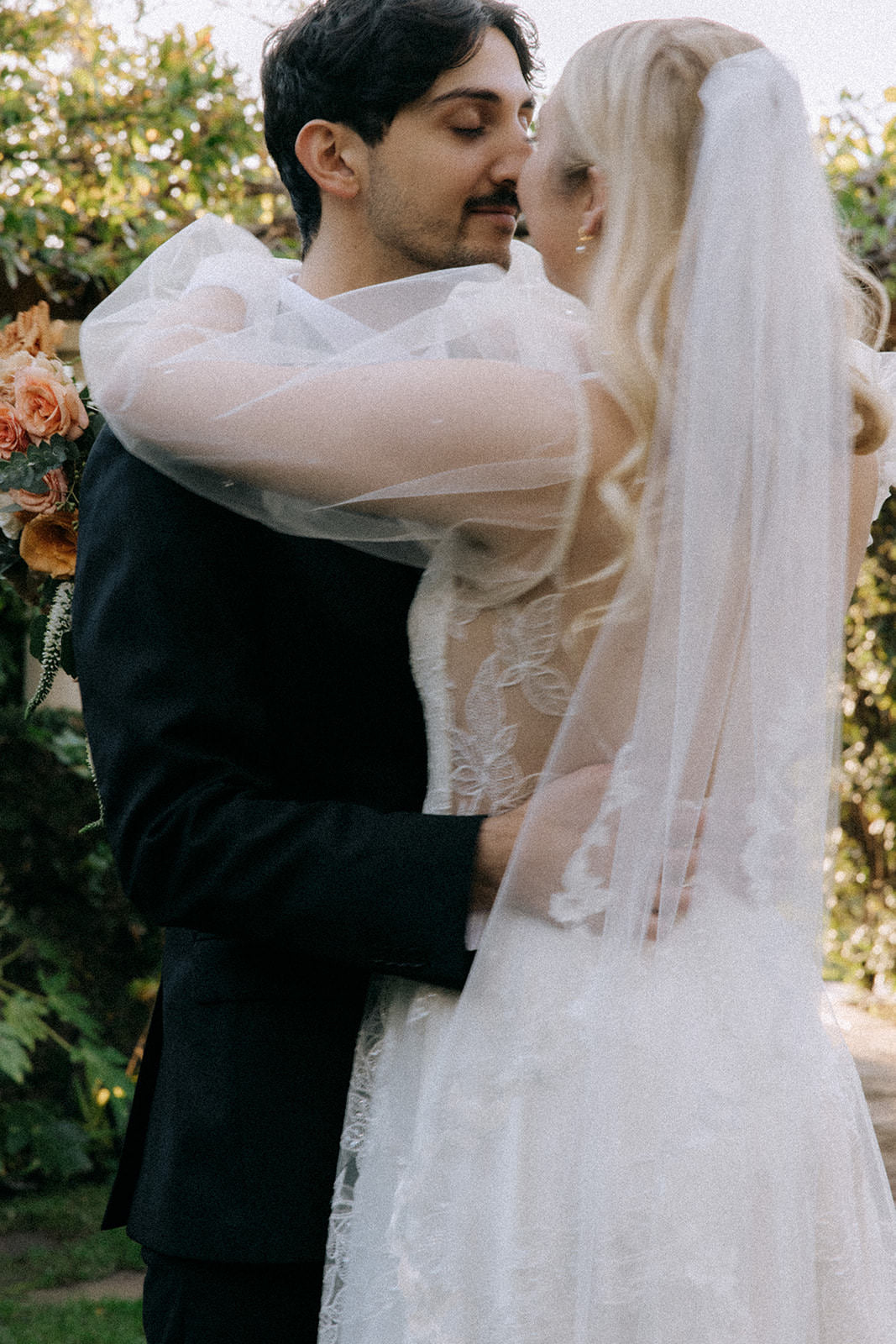 puffy tulle wedding sleeves on bride in leaf veil and botanical flowy dress