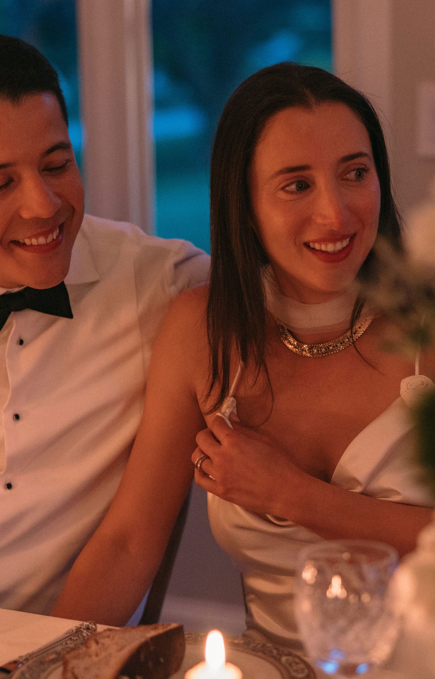 jewish wedding reception with bride in narrow silk tulle scarf and silver collar necklace
