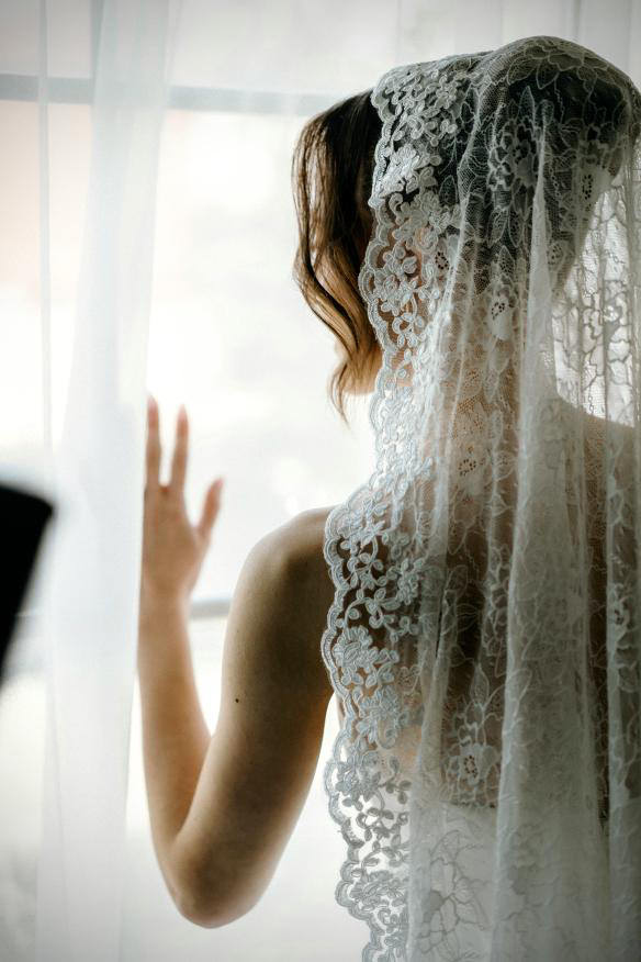 high updo bride hairstyle with romantic ivory lace mantilla wedding veil