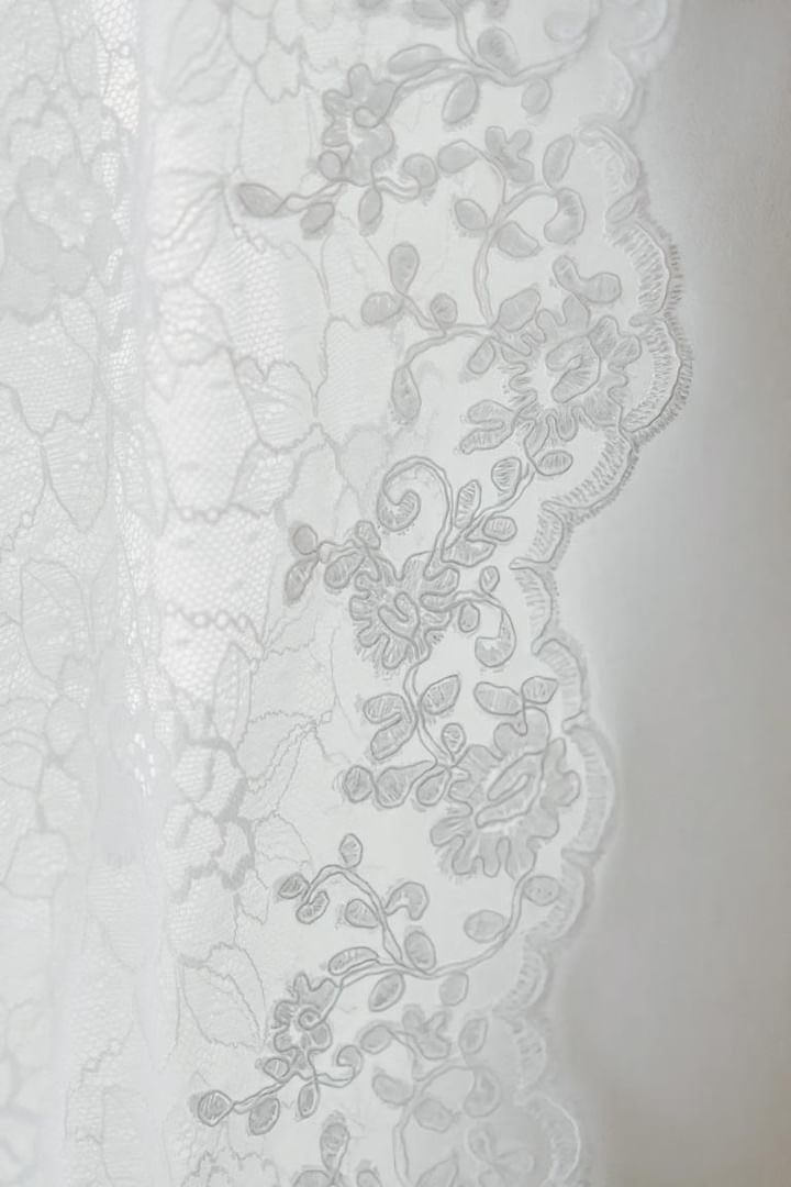 French alencon lace trim on mantilla wedding veil in white