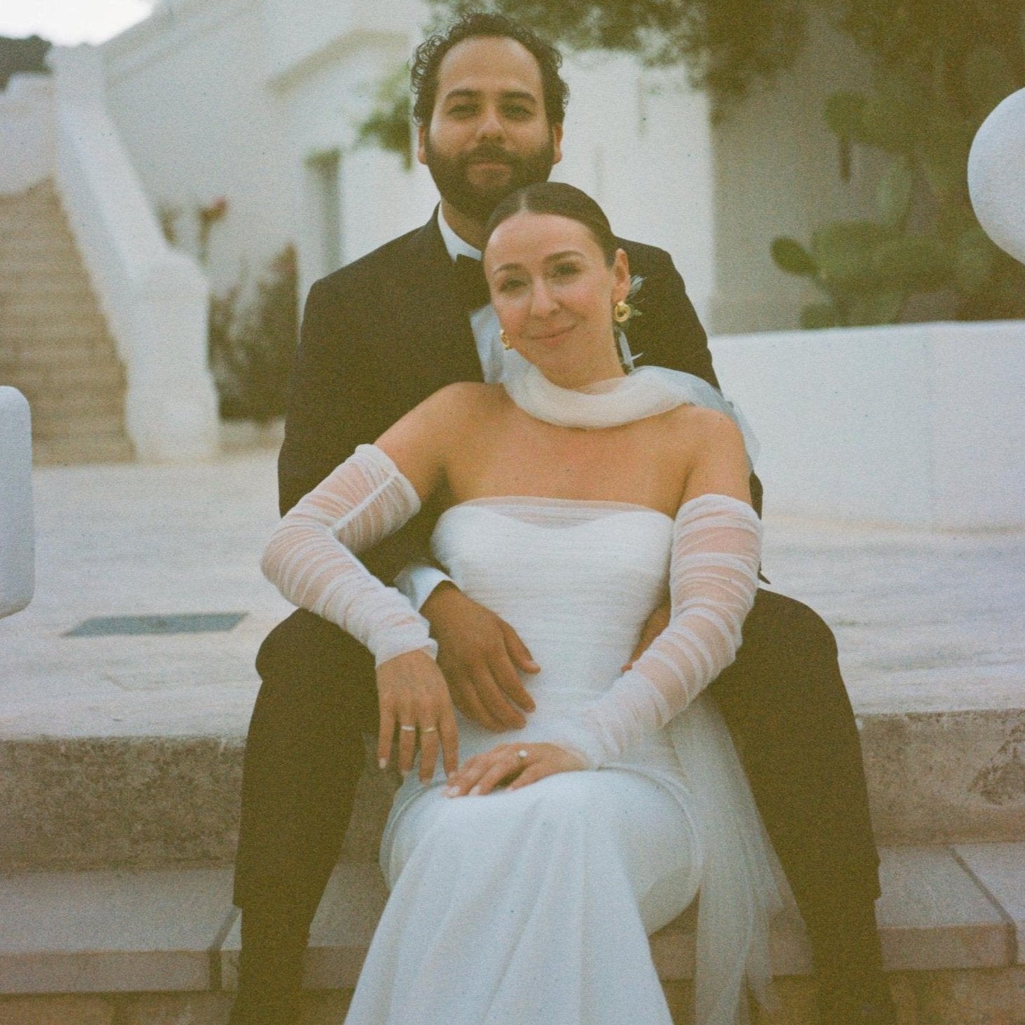 cool effortless bride in rusched fingerless gloves and long tulle bridal scarf