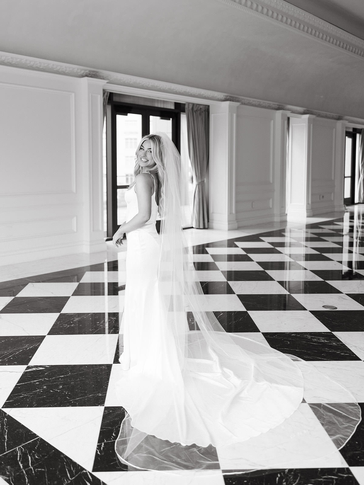 sexy bride in long cathedral bridal veil with satin bound wedding veil