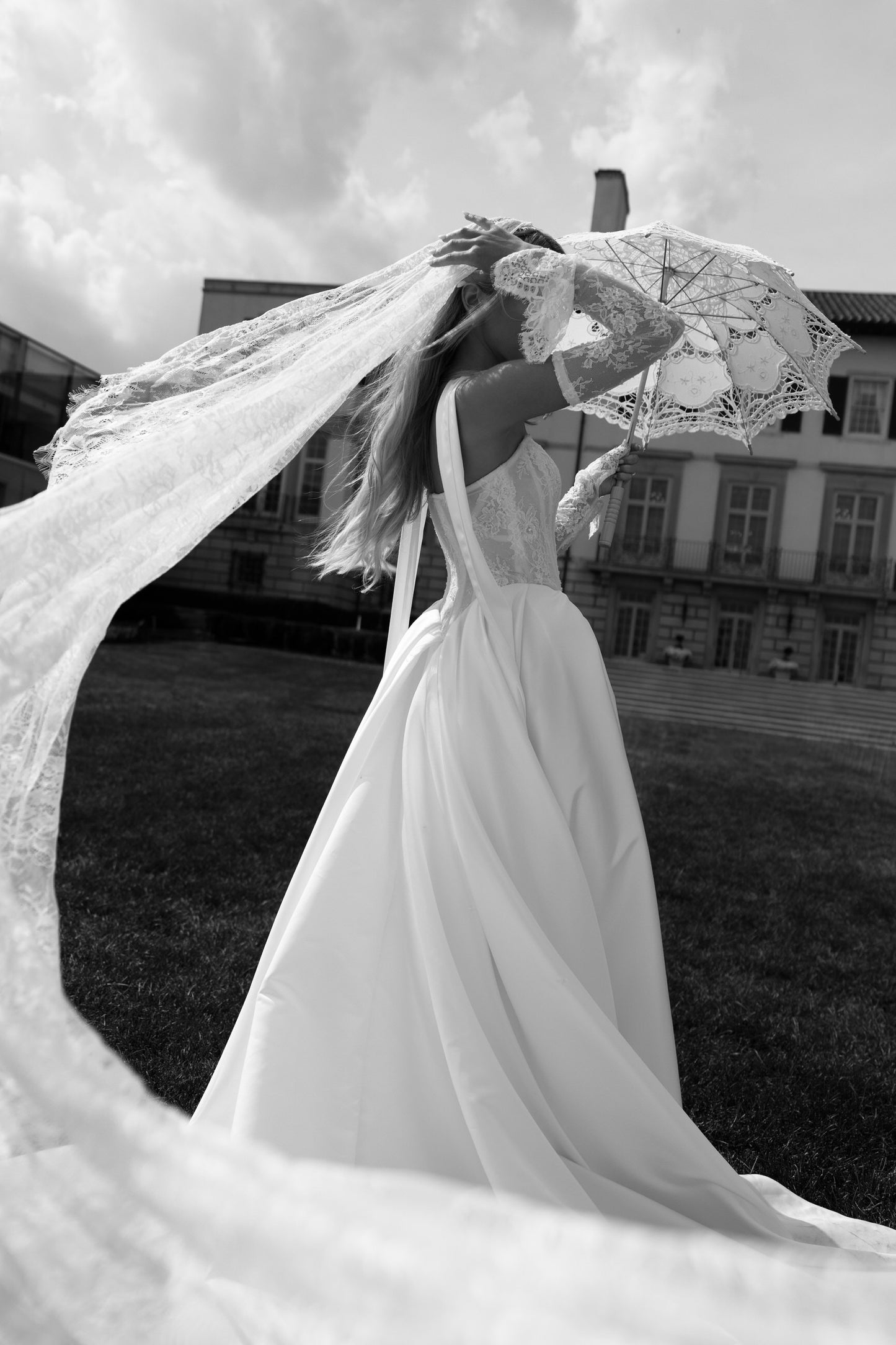 throwback fashion inspired bridal gown with bride in neck scarf and soft lace veil and matching gloves