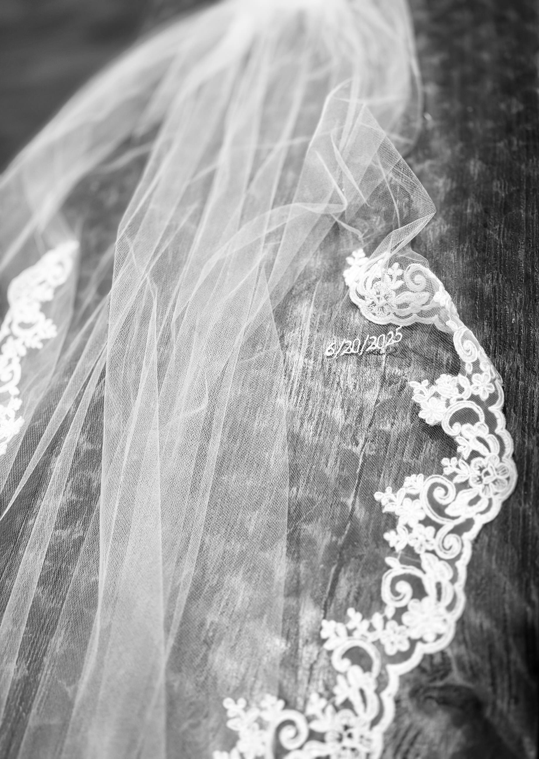 French lace wedding veil with small monogrammed embroidery
