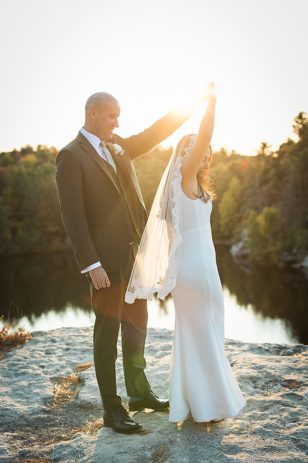 elopement photo with bride in medium length fingertip bridal veil with lace trim