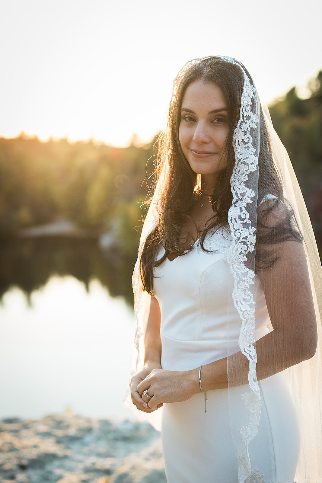 elopement bridal look with simple crepe gown and fingertip length lace bridal veil mantilla style