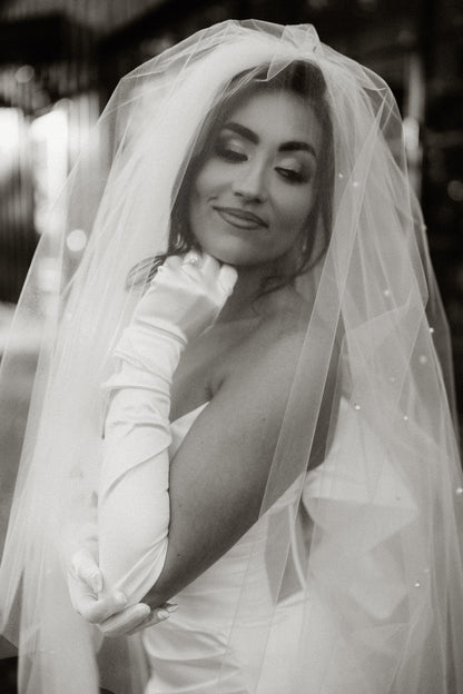 two tier puffy bridal veil with scattered pearls and matching satin gloves
