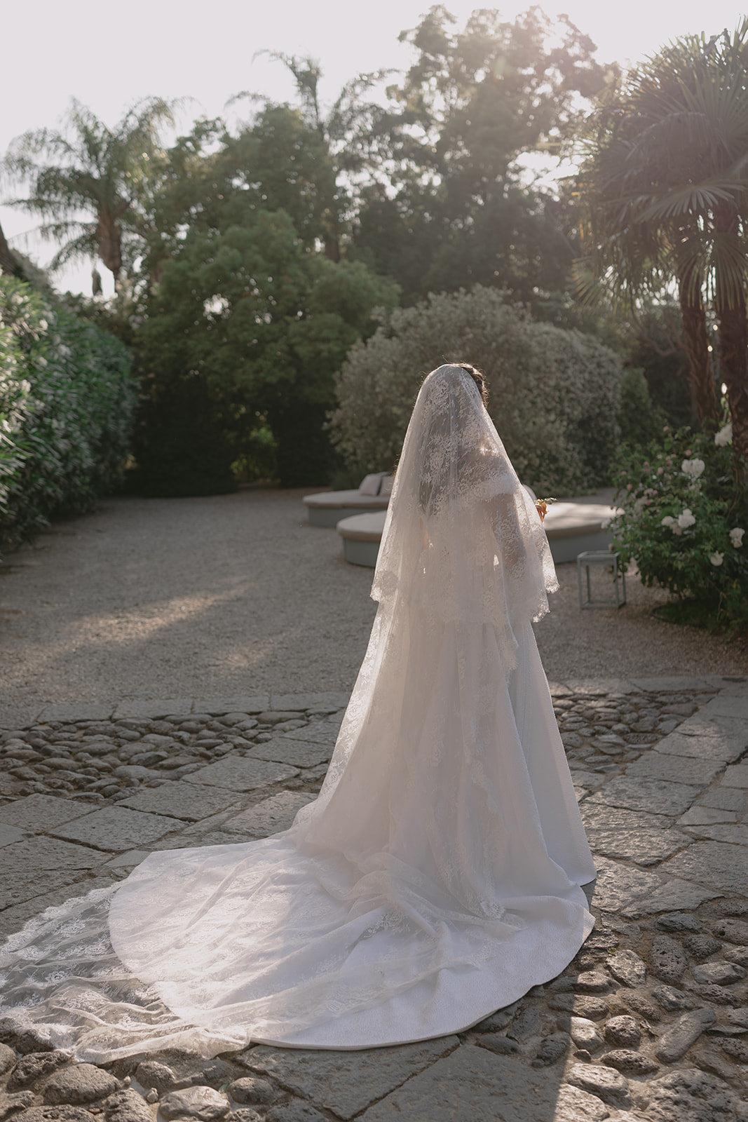 Italy lace cathedral veil with blusher in gardens
