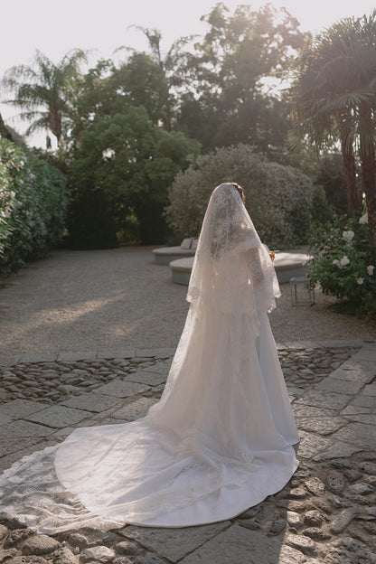 Italy lace cathedral veil with blusher in gardens
