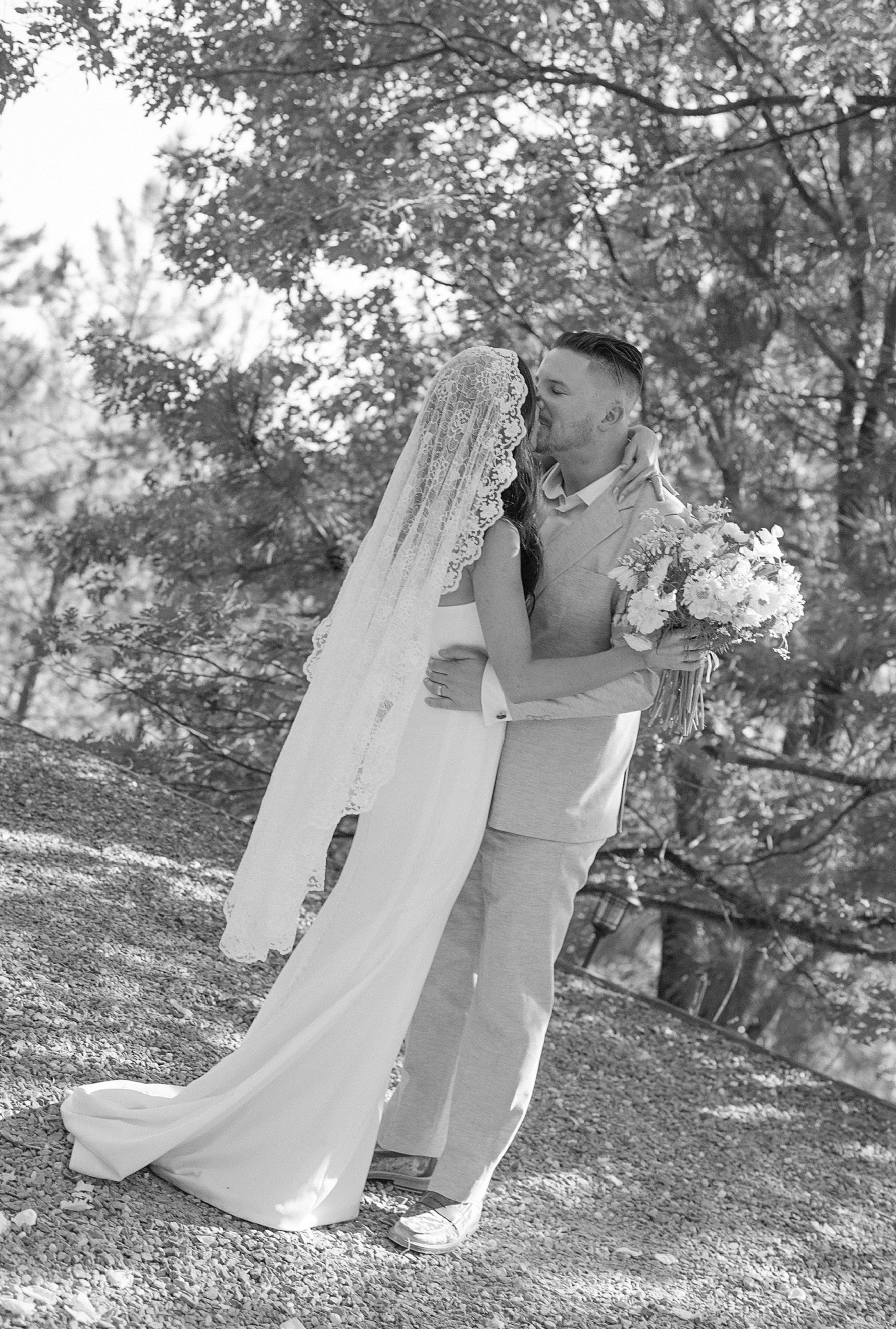 romantic allover lace mantilla bridal veil in waltz length with sheath crepe dress for woods wedding